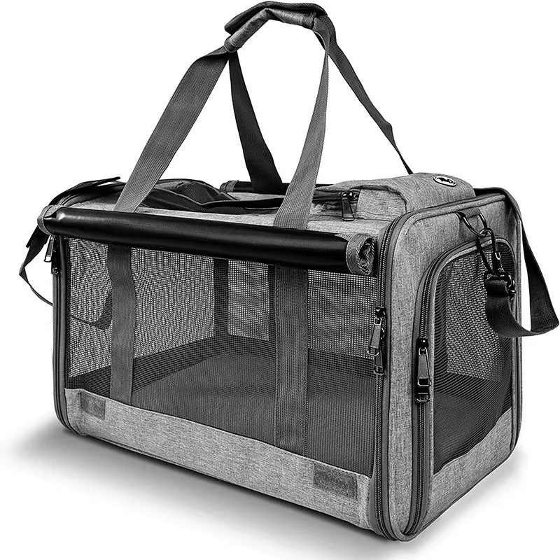 Gray pet carrier with mesh sides and handle on a white background