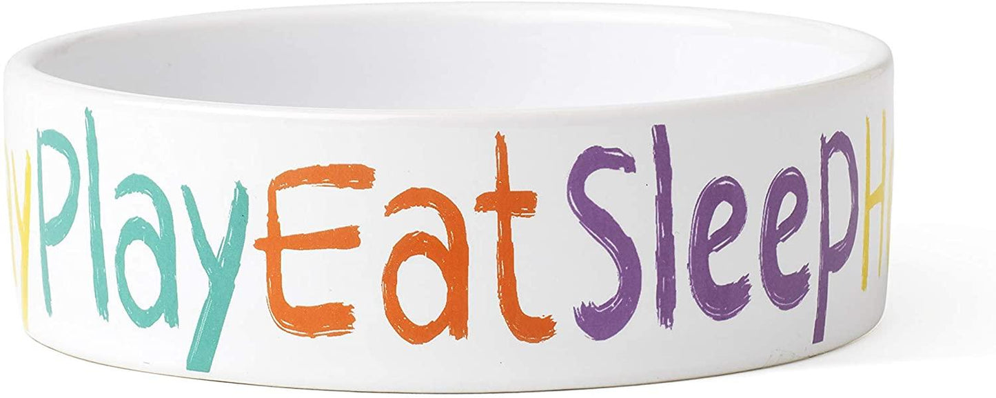 White bowl with colorful text 'Play Eat Sleep' on a white background