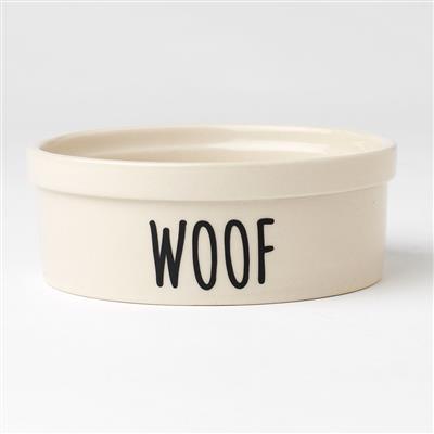 Beige ceramic pet bowl with 'WOOF' text on a white background