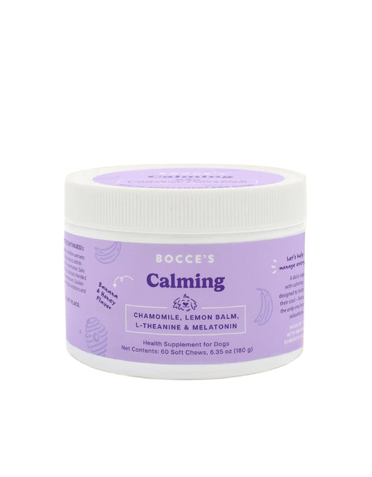Purple jar of Bocce's Calming supplement for dogs on a beige background