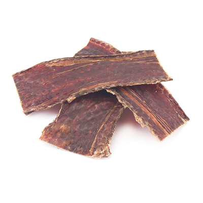 Three pieces of dried beef jerky for dogs on a white background